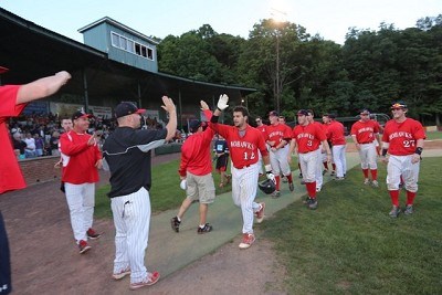 John Sansone (Florida State) is welcomed back to the dugout after hitting a 2-run home run in the sixth inning